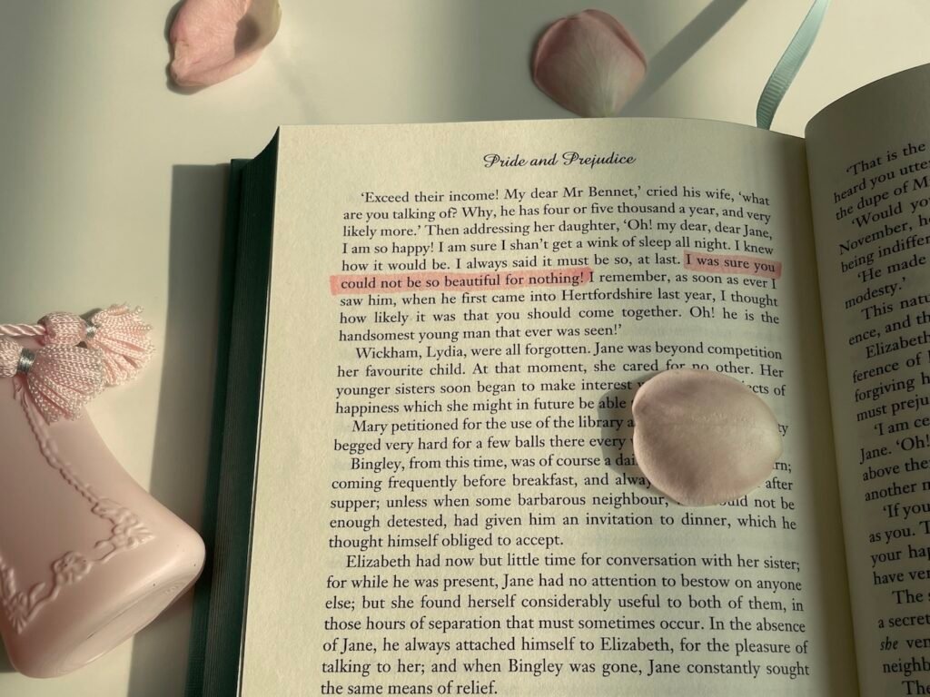 delina perfume photographed with a classic book