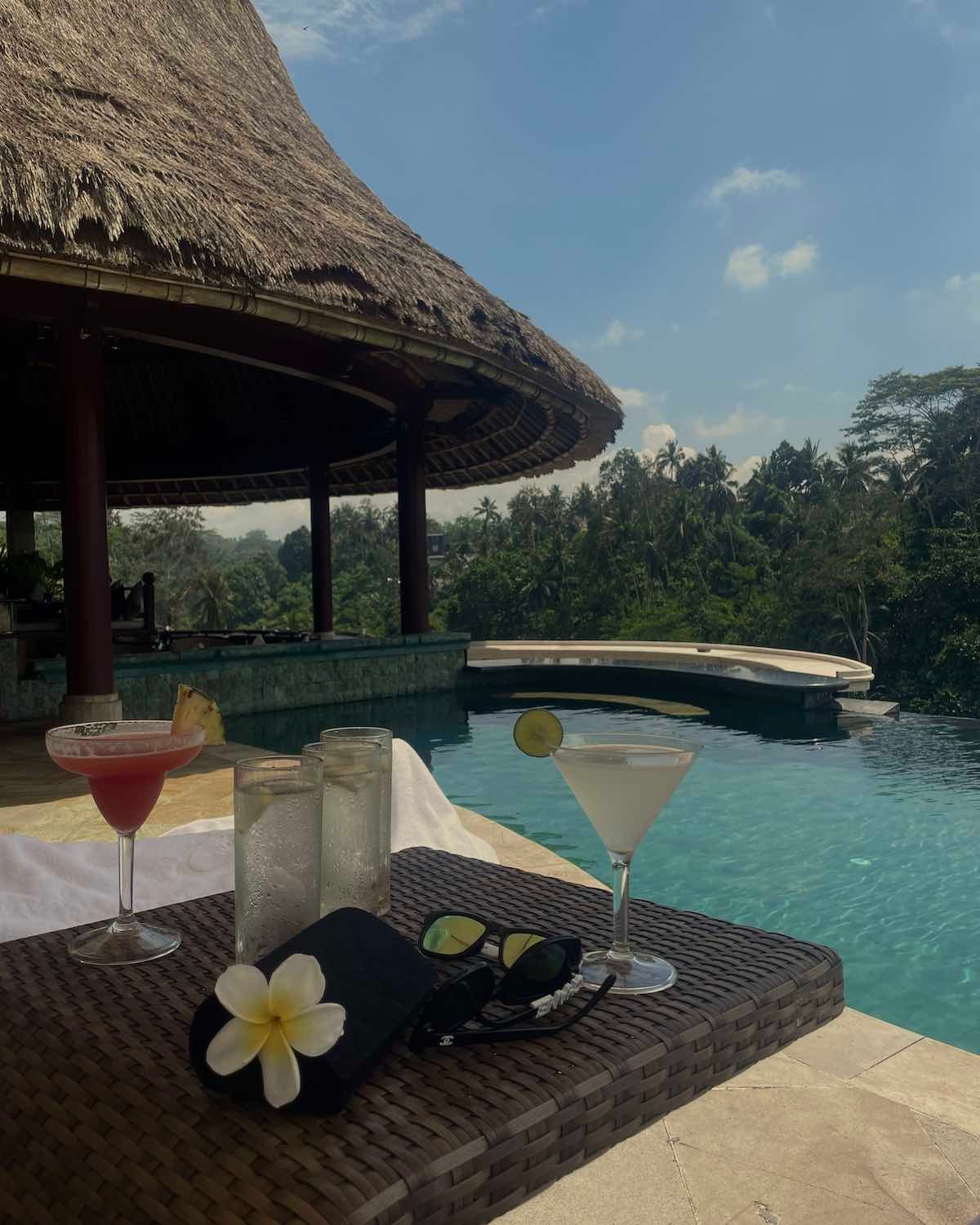 tropical poolside setting with cocktails in bali resort