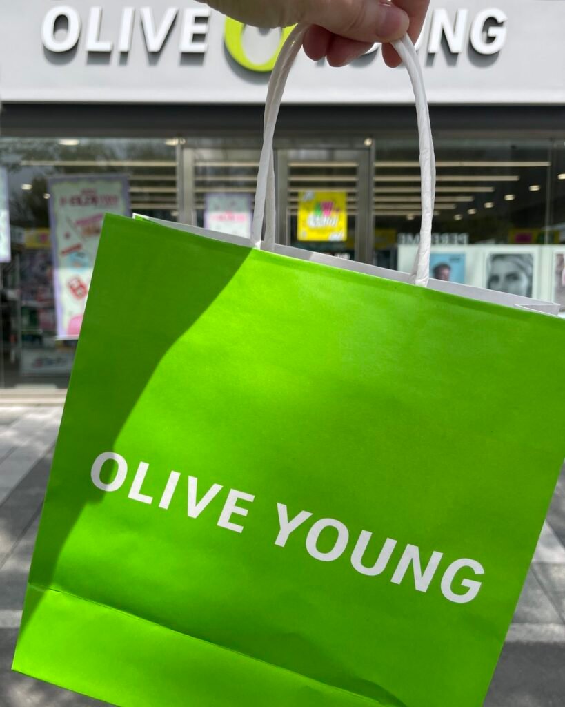 Under Seoul Skies, in Petals shopping bag in front of the store