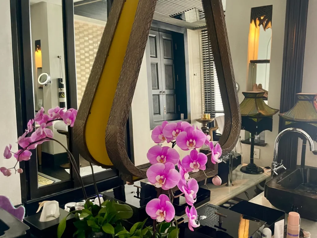 A Return to InterContinental Danang Sun Peninsula Resort Bathroom interior with orchids at InterContinental Danang Sun Peninsula Resort